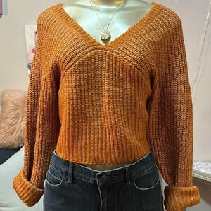 Selling an Arizona orange top, size medium, stylish V-neck, ribbed texture.